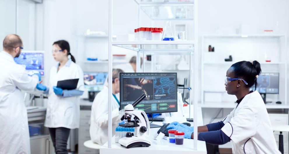 Scientist sitting at her workplace in modern laboratory