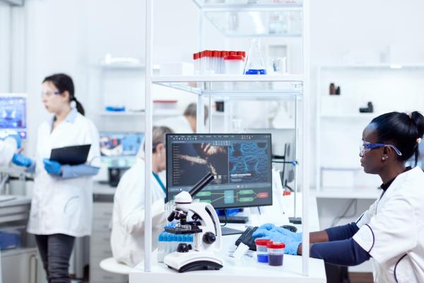 Scientist sitting at her workplace in modern laboratory